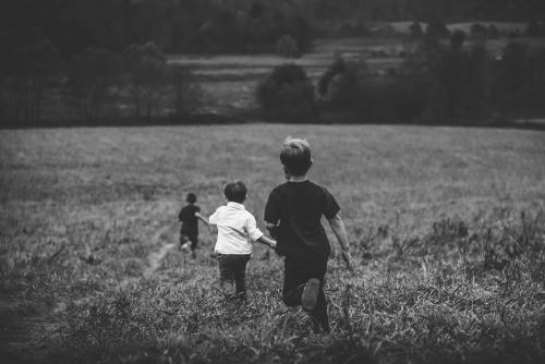 kids running through field